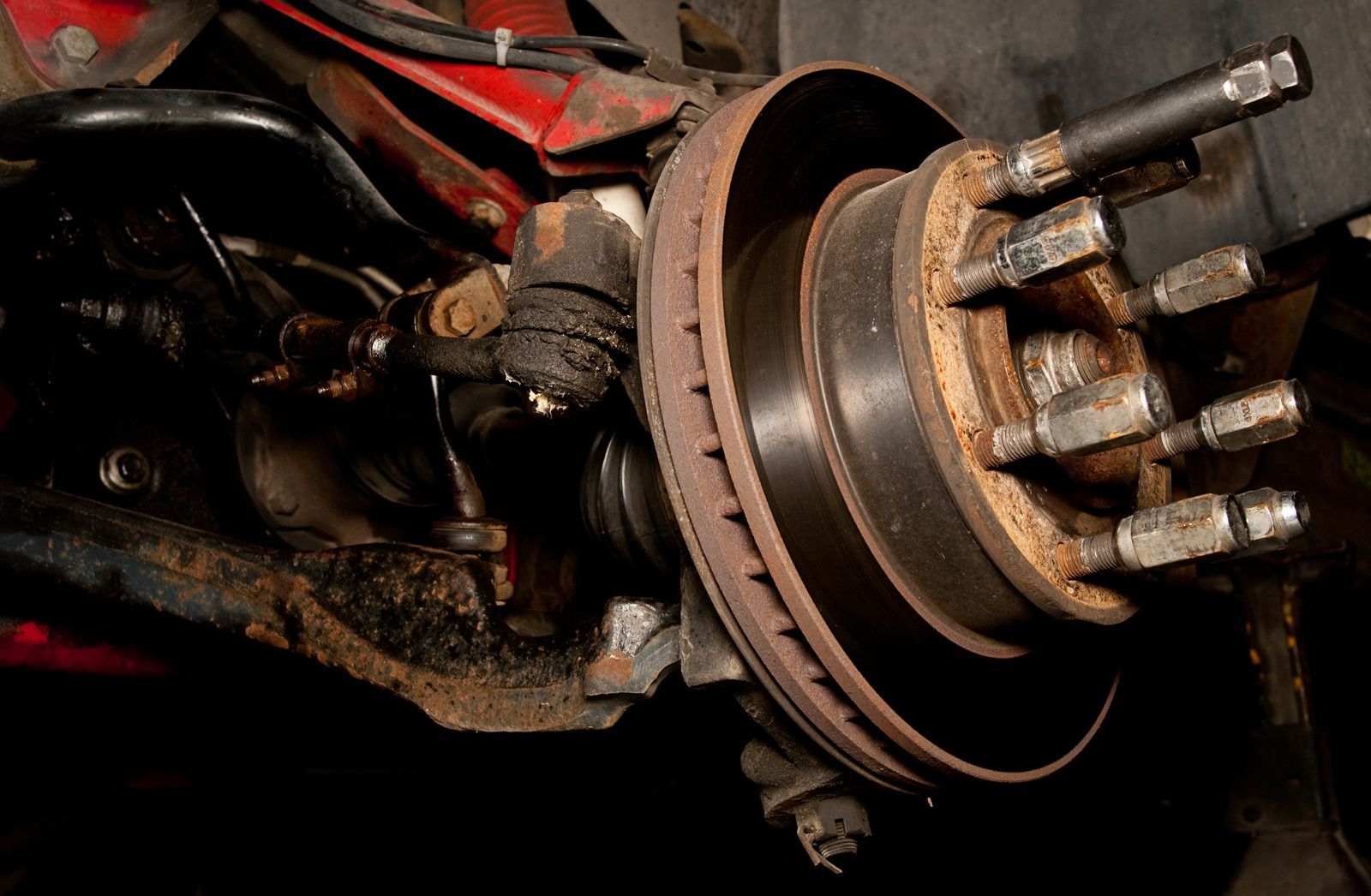 A close up of a brake disc on a car.