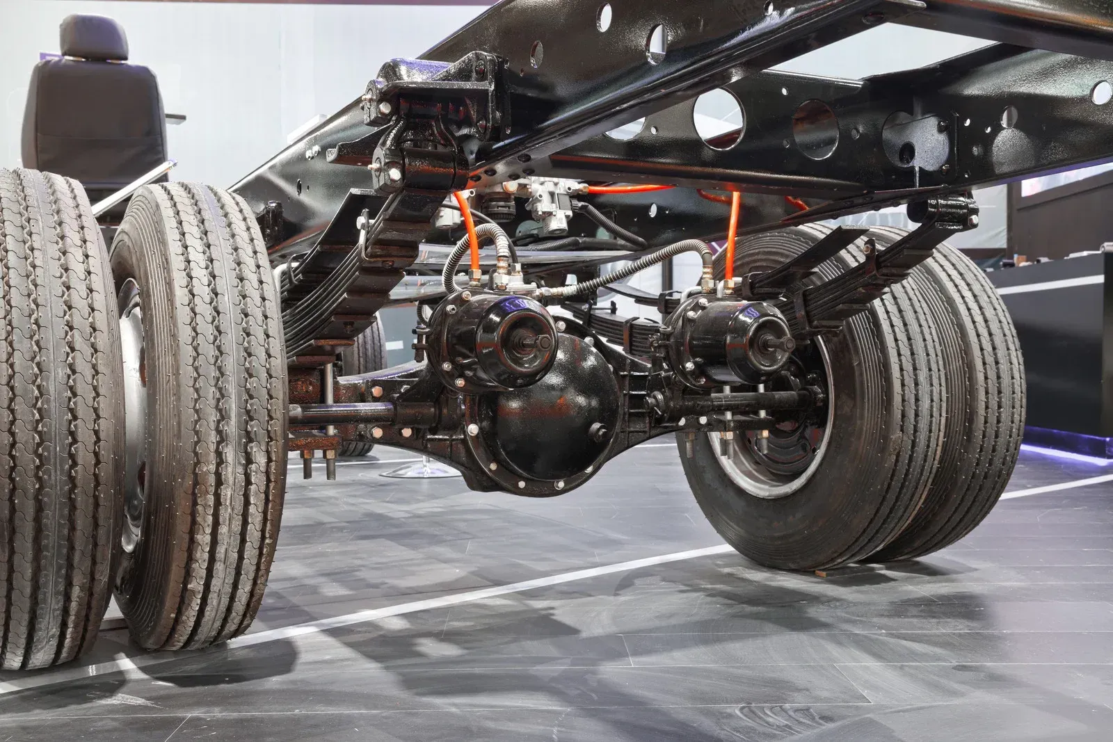 A close up of the rear suspension of a truck.