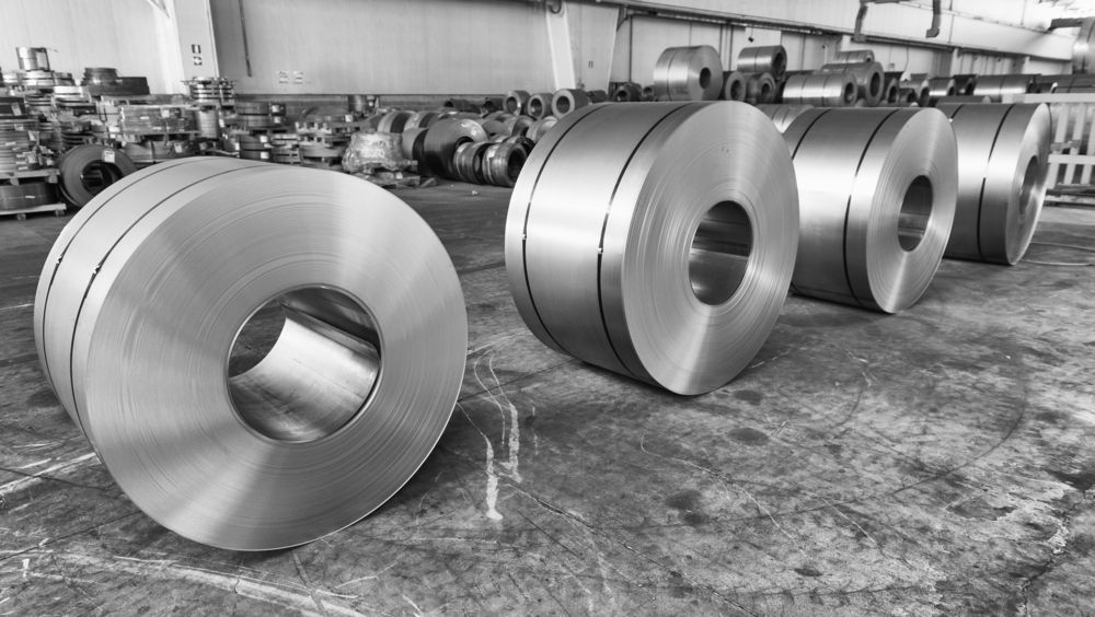 A Black and White Photo of Stainless Steel Rolls in A Factory — Betts Welding Pty Ltd In Moss Vale, NSW