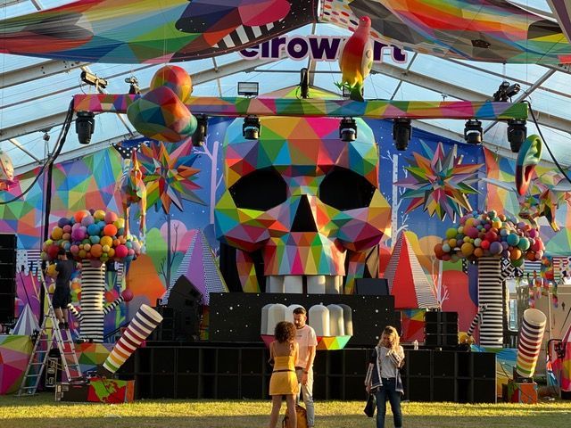 A colorful stage with a large skull on it