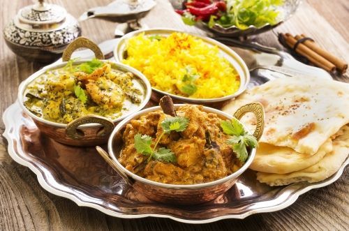 A Silver Tray Topped With Bowls Of Food And Naan Bread — Suhana Butcher & Grocery Shop In Millner, NT
