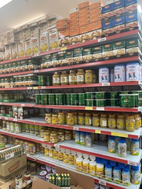 Shelves In A Grocery Store Filled With Jars And Boxes — Suhana Butcher & Grocery Shop In Millner, NT