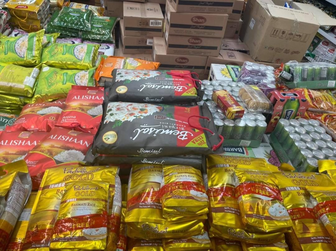 A Variety Of Food Items Are Stacked On Top Of Each Other In A Store — Suhana Butcher & Grocery Shop In Millner, NT