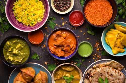 A Variety Of Indian Food In Bowls And Plates On A Table — Suhana Butcher & Grocery Shop In Millner, NT