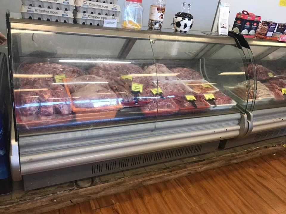 A Butcher's Display Case Filled With Meat And Eggs — Suhana Butcher & Grocery Shop In Millner, NT