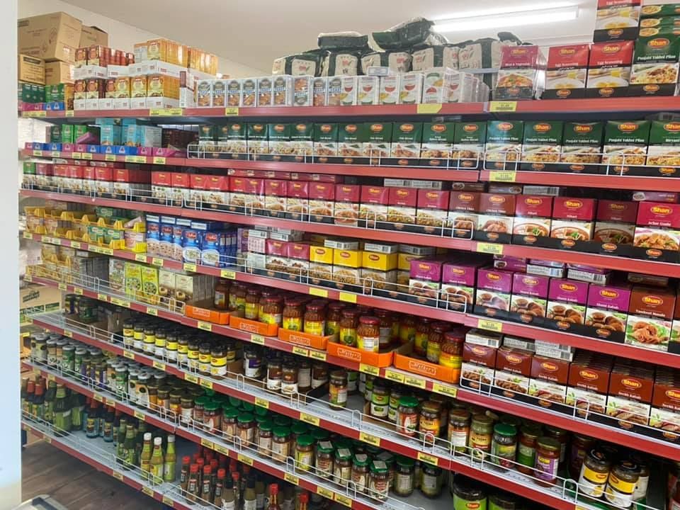 A Grocery Store Aisle Filled With Lots Of Food Items — Suhana Butcher & Grocery Shop In Millner, NT