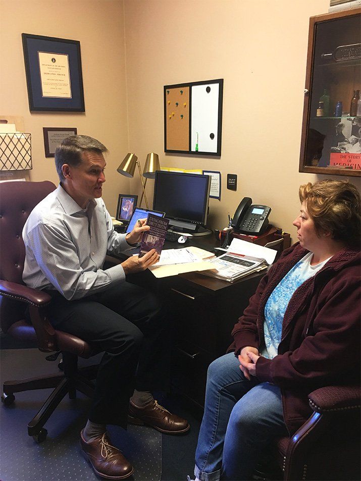 christine lewis talking with man