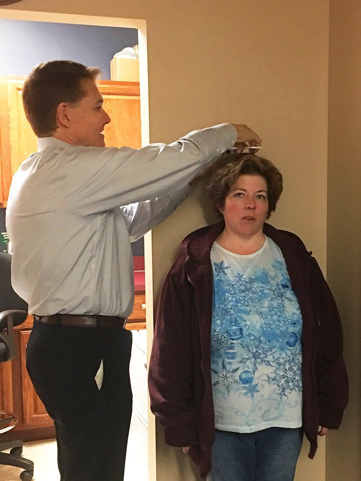 christine lewis height measuring