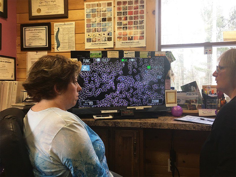 christine lewis behind desk