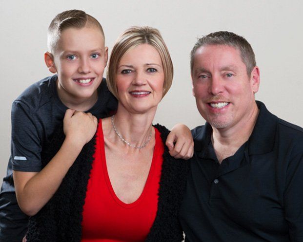 parents and son smiling