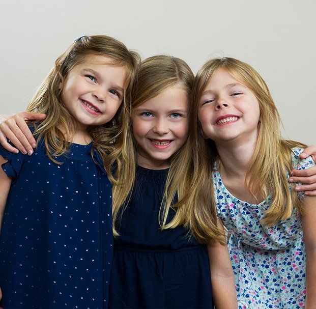 three girls smiling
