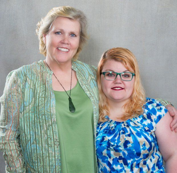 elder woman and daughter smiling