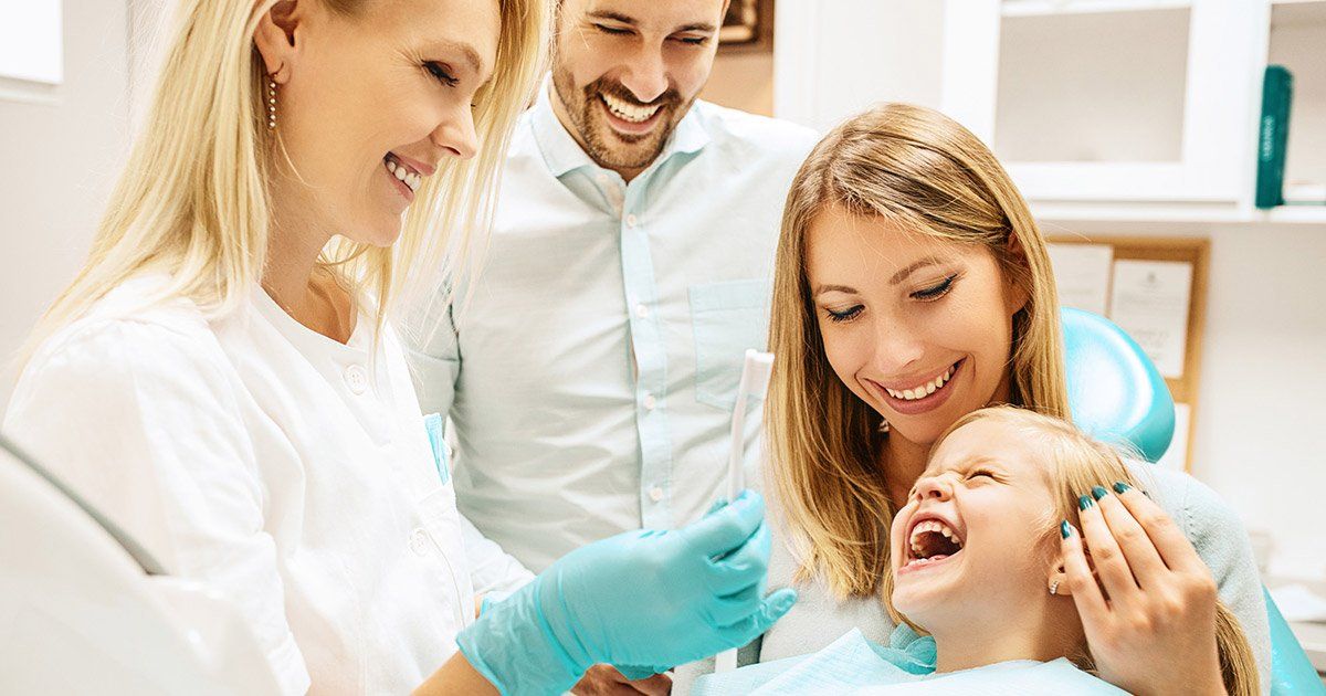 smiling family at dentist