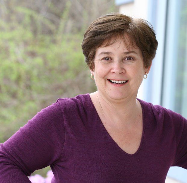 woman with short hair smiling