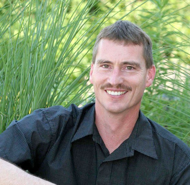 man with mustache smiling