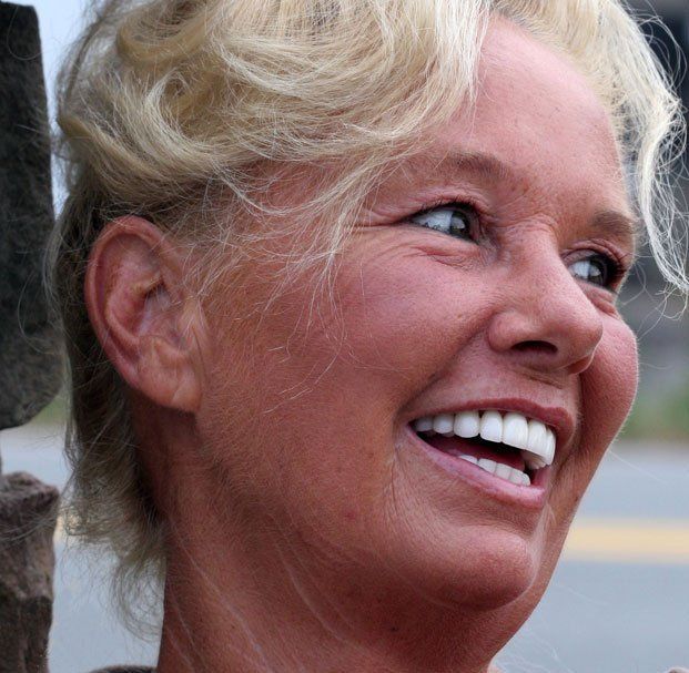 elder woman side smiling red face