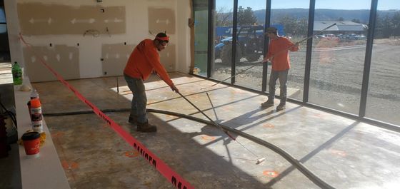 Two Men Working On Floors — Muldrow, OK — Gypsum Floors of AR/OK, Inc