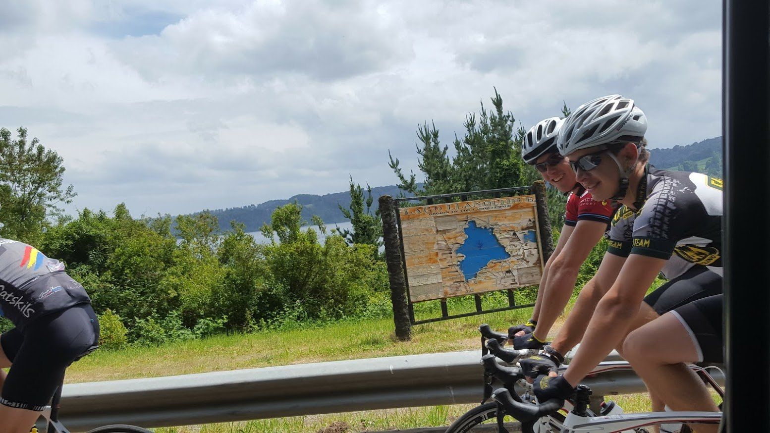 A group of people are riding bicycles on a road.