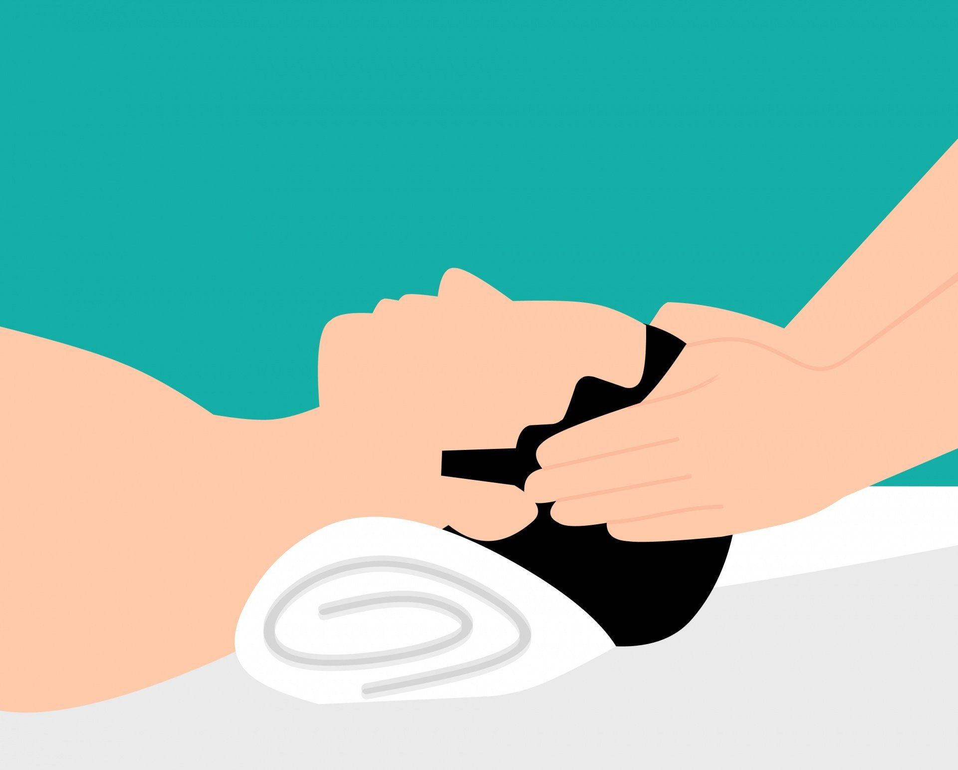 A person is laying on a table getting a massage.