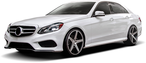 White Mercedes-Benz sedan with custom alloy wheels, angled slightly to the left. | Crutcher's Auto Repair