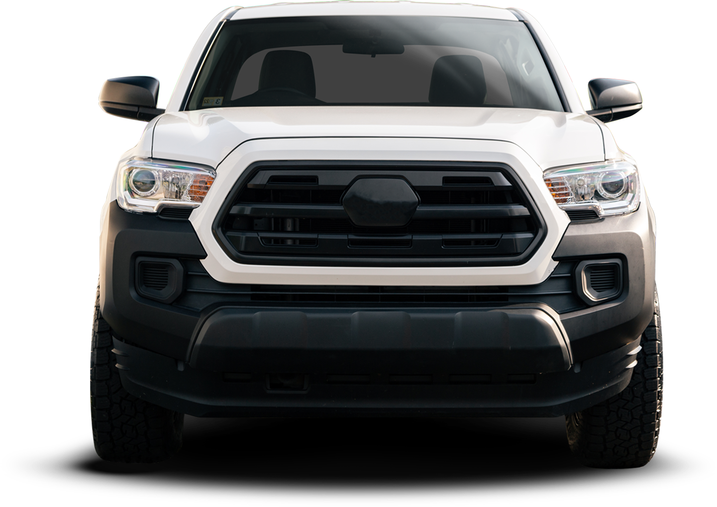 White Toyota pickup truck, black grill and bumper, on a white background.| Crutcher's Auto Repair