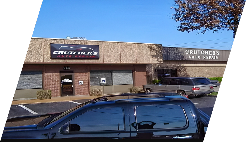 Crutcher's Auto Repair building with a black vehicle in front, sunny day.| Crutcher's Auto Repair