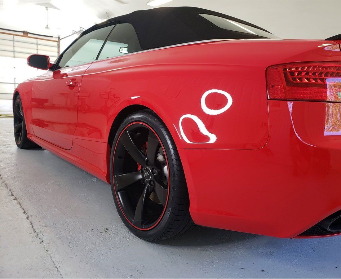 A red car with the number 80 on the side