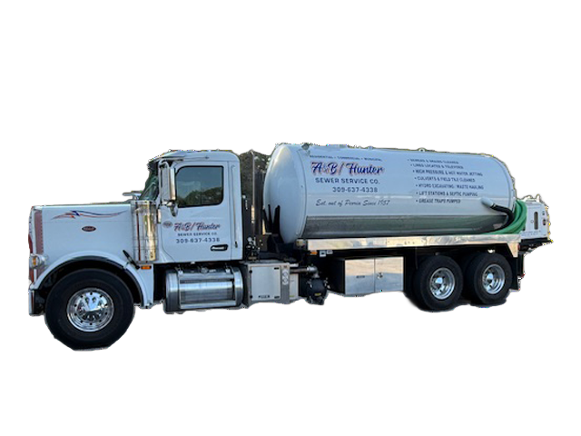 White septic tank truck with a cylindrical tank, parked on a paved surface. White septic tank truck with a cylindrical tank, parked on a paved surface.