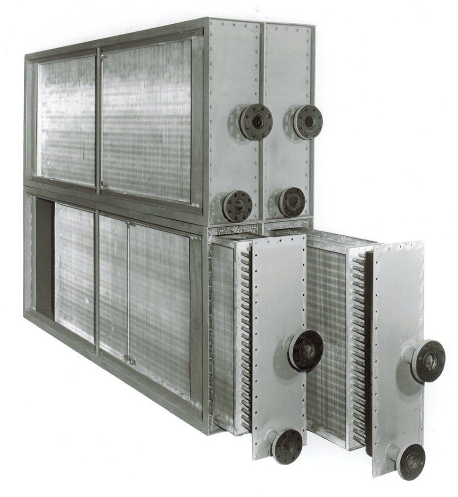 A black and white photo of three radiators stacked on top of each other.