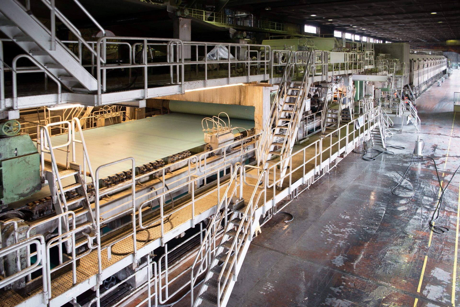 A large factory with a lot of machinery and stairs.