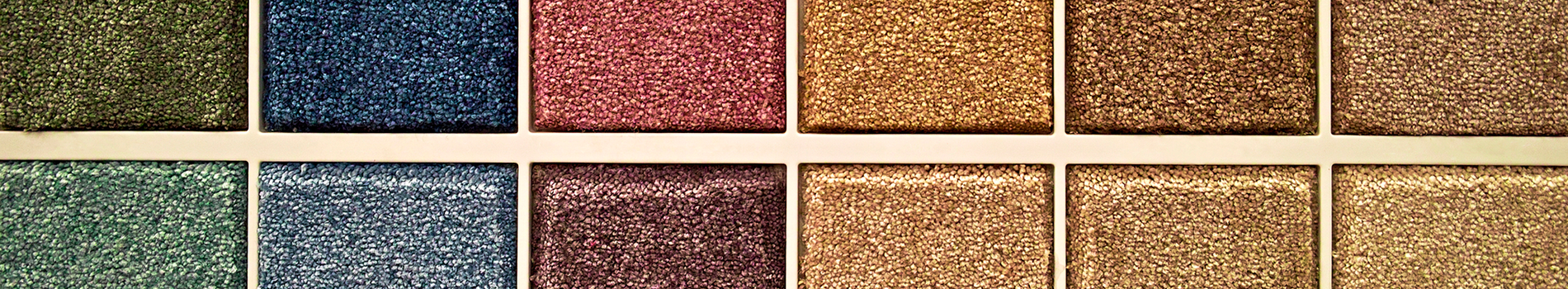 A palette of small squares, each with a different textured color, ranging from green to brown.