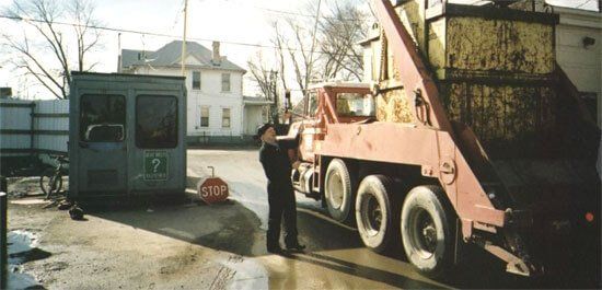 Scrap Recycling Company — Man Checking Truck's Load in Dayton, OH