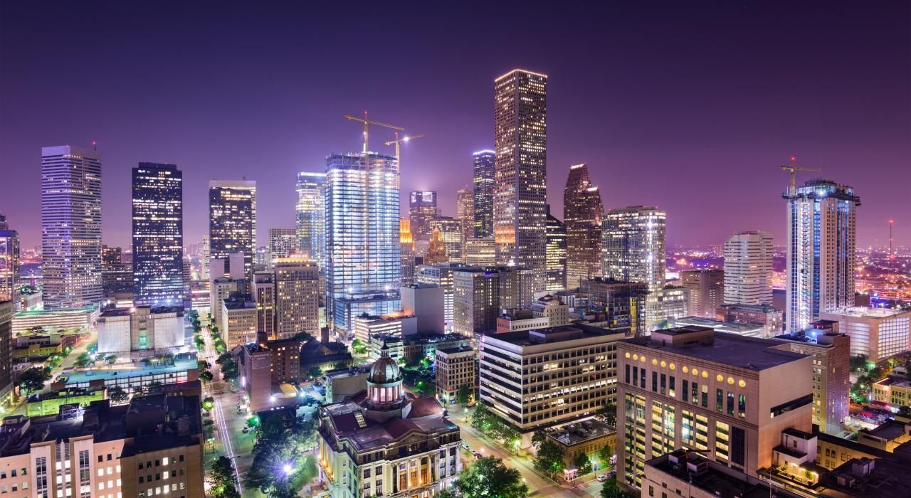 An aerial view of a city skyline at night.