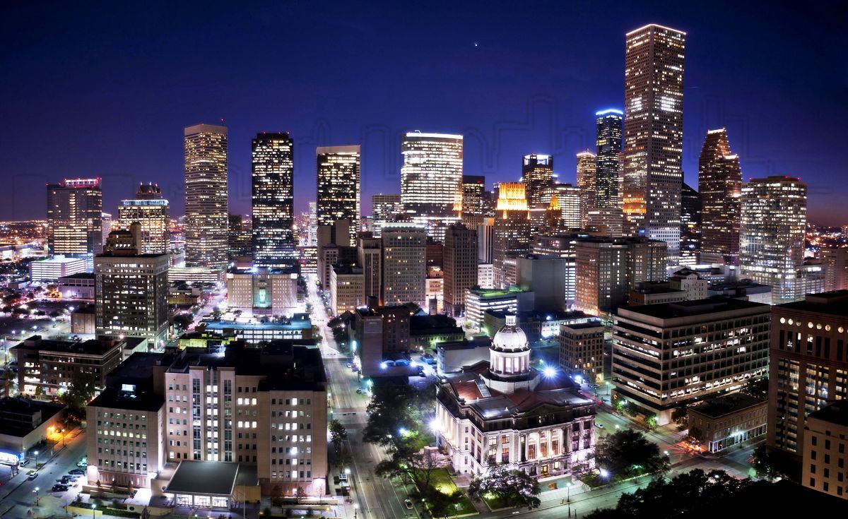 An aerial view of a city skyline at night