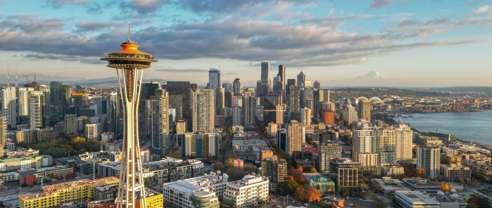 An aerial view of seattle skyline with the space needle in the foreground.