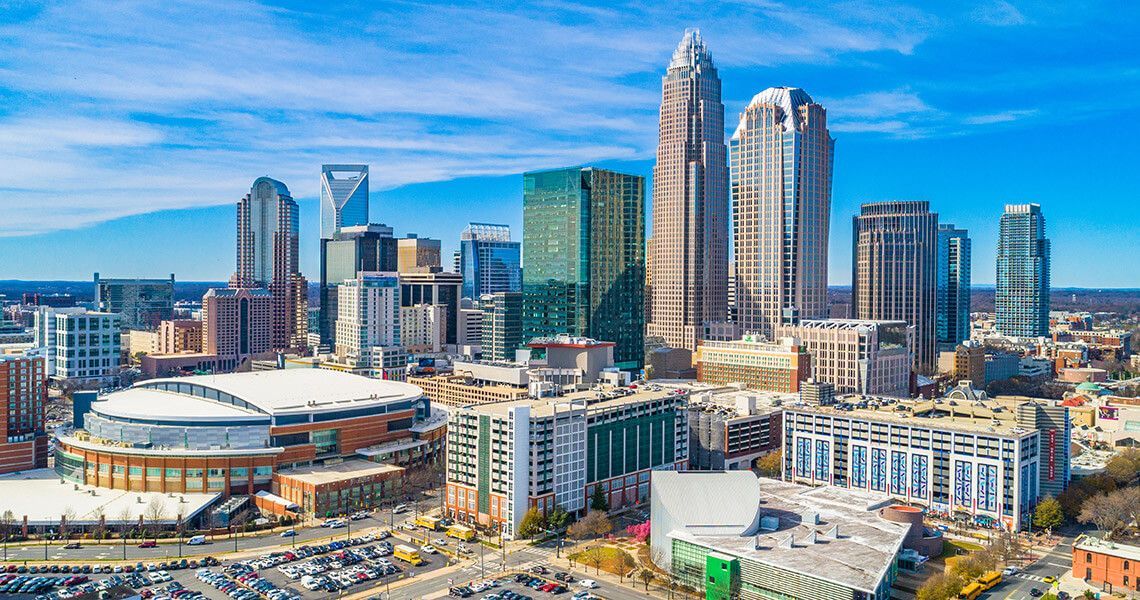 An aerial view of a city skyline on a sunny day.
