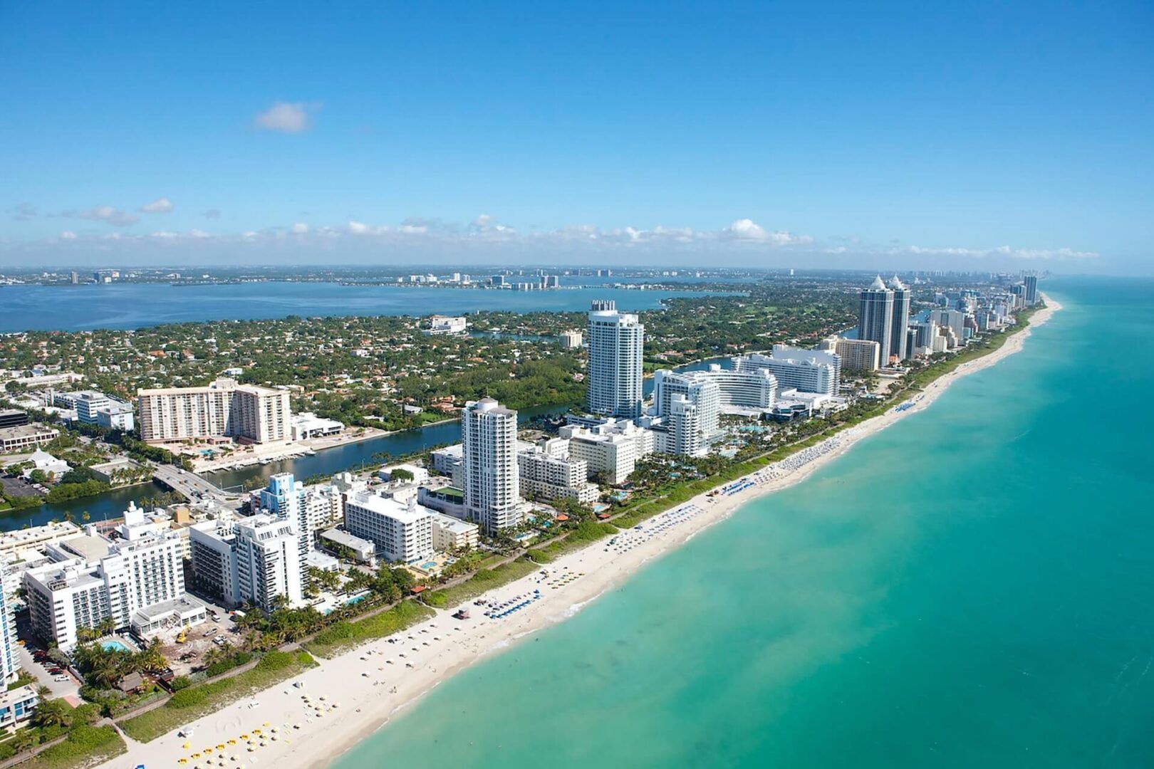 An aerial view of a city and a beach.