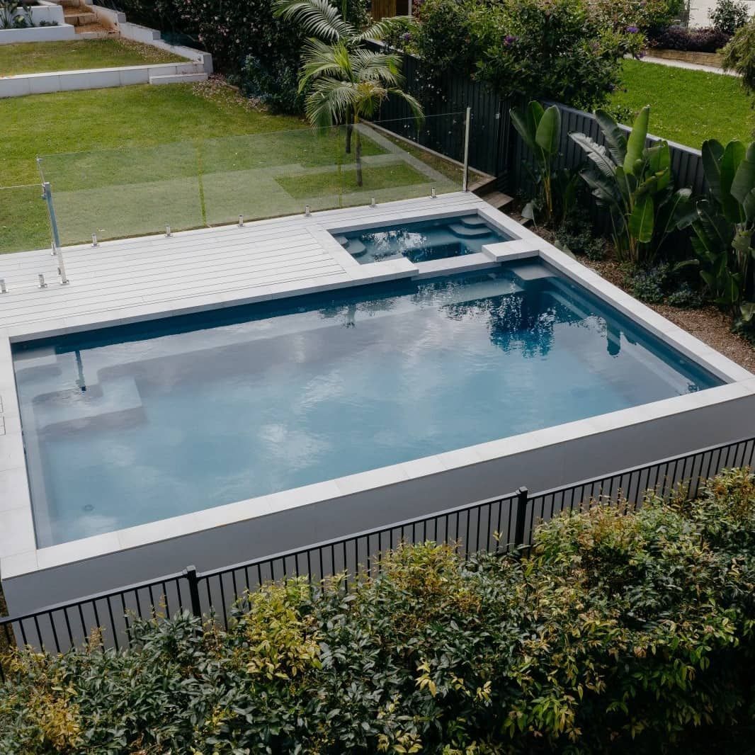 An Aerial View of a Large Swimming Pool in a Backyard Surrounded by Trees — Pooltech NT In Alawa, NT