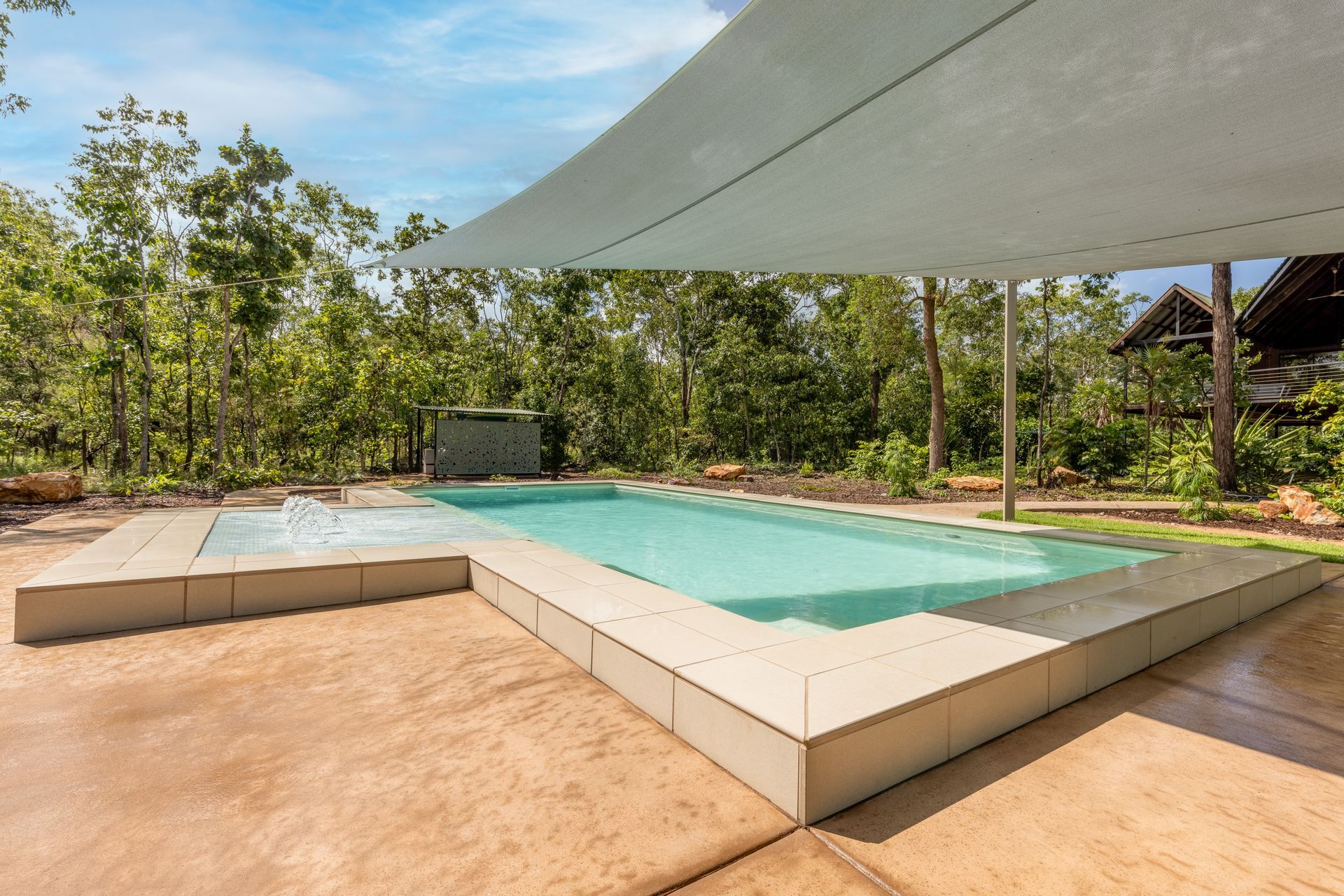A Large Swimming Pool with A Canopy Over It Surrounded by Trees — Pooltech NT In Alawa, NT