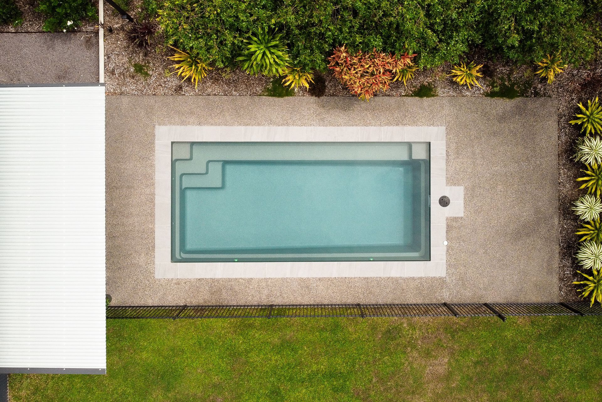 An Aerial View of A Small Swimming Pool in A Backyard — Pooltech NT In Alawa, NT
