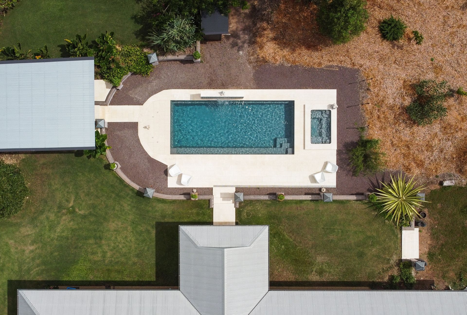 An Aerial View of A Large Swimming Pool in The Backyard of A House — Pooltech NT In Alawa, NT