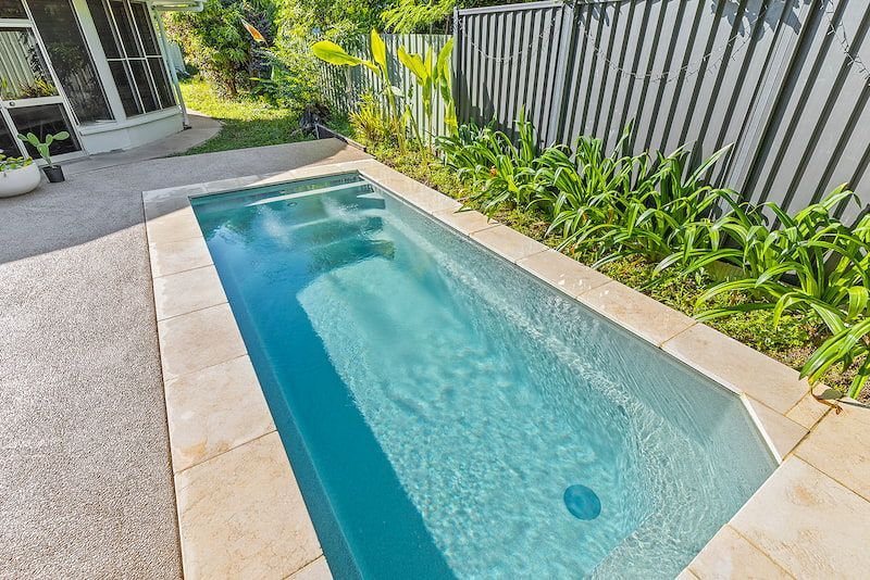A Large Swimming Pool in the Backyard of a House — Pooltech NT In Alawa, NT