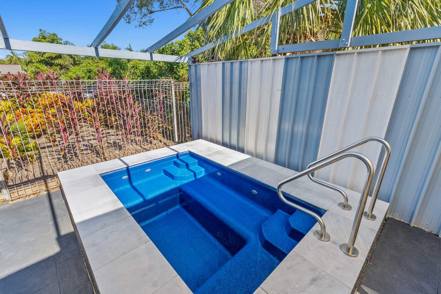 A Small Swimming Pool With Stairs Leading to It — Pooltech NT In Alawa, NT