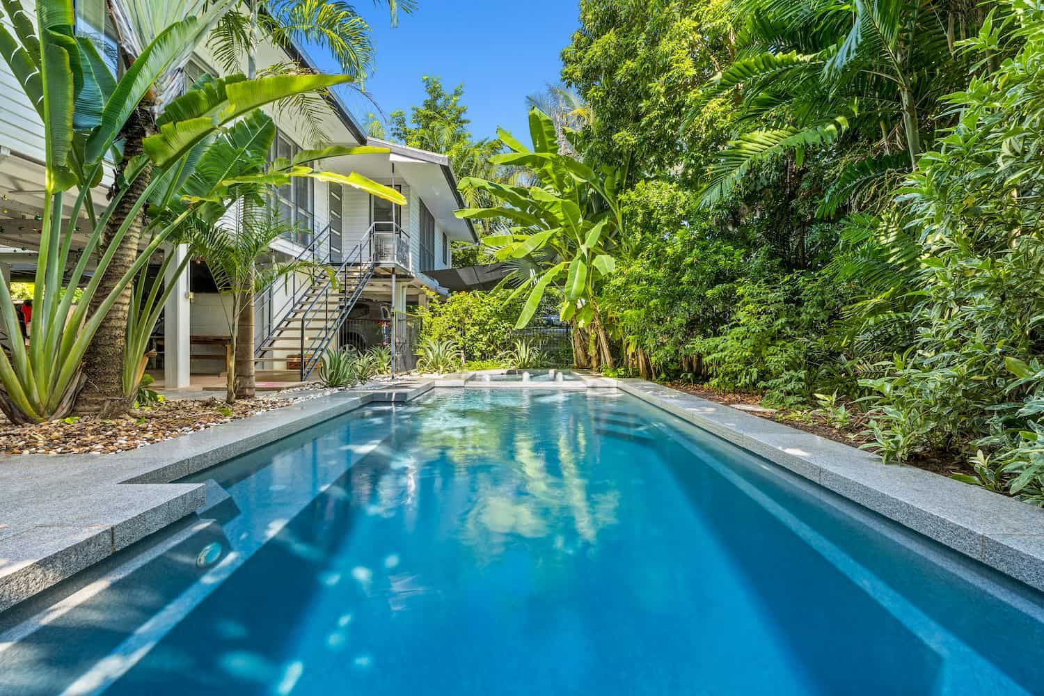 A Large Swimming Pool in the Backyard of a House — Pooltech NT In Alawa, NT