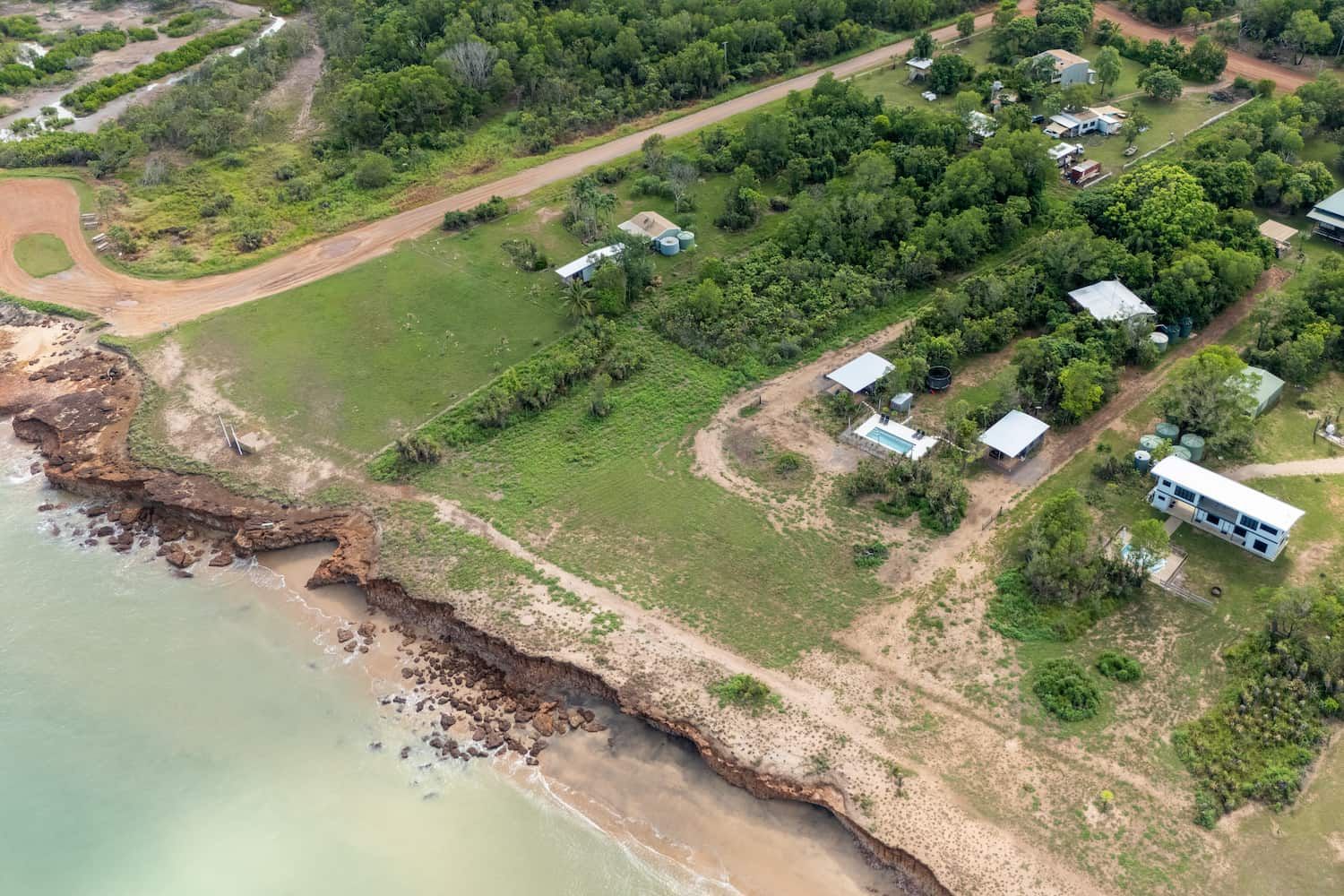 There is a Covered Area With a Table and Chairs Under a Canopy — Pooltech NT In Alawa, NT