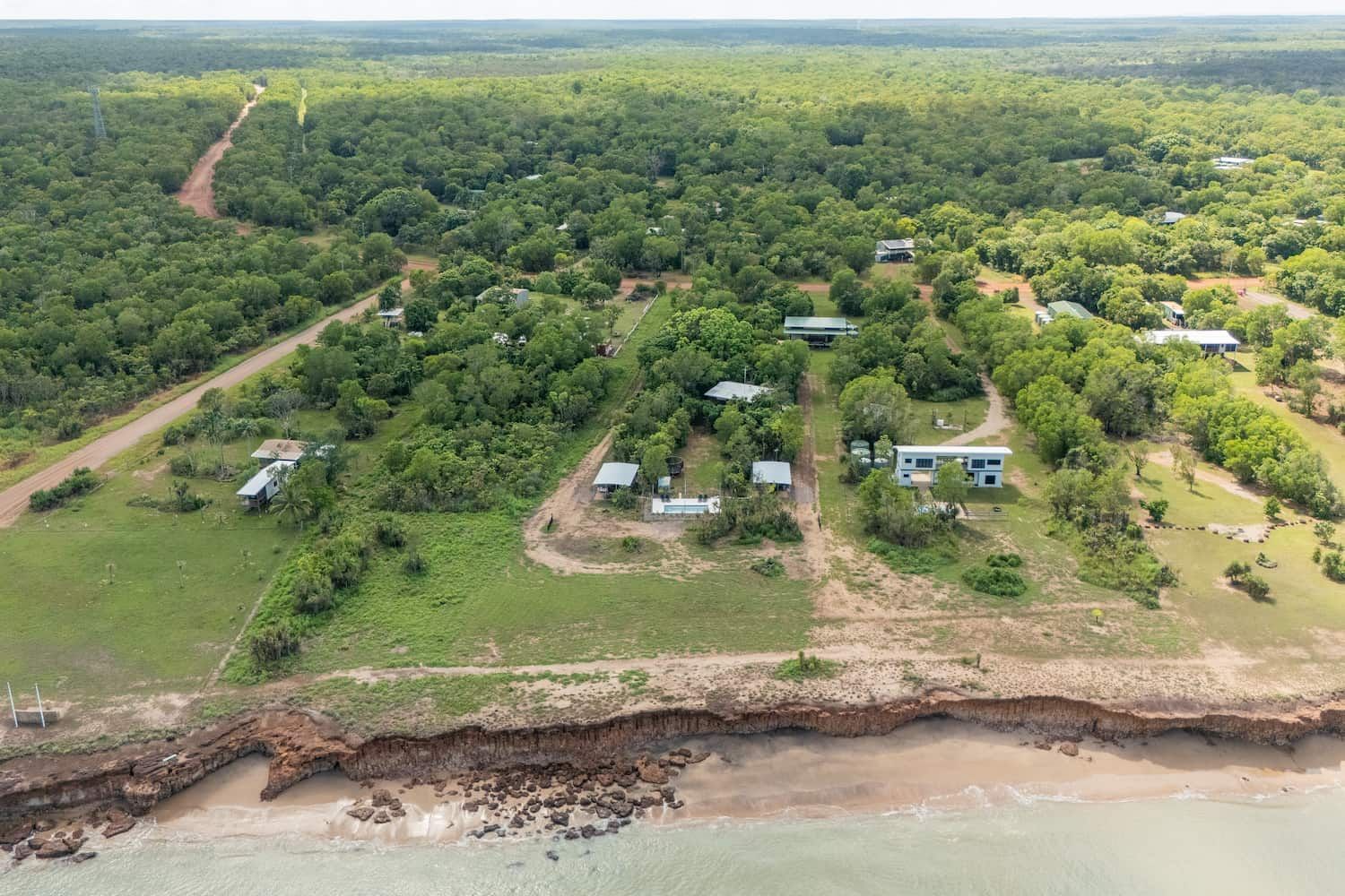 An Aerial View of a Residential Area Next to the Ocean — Pooltech NT In Alawa, NT