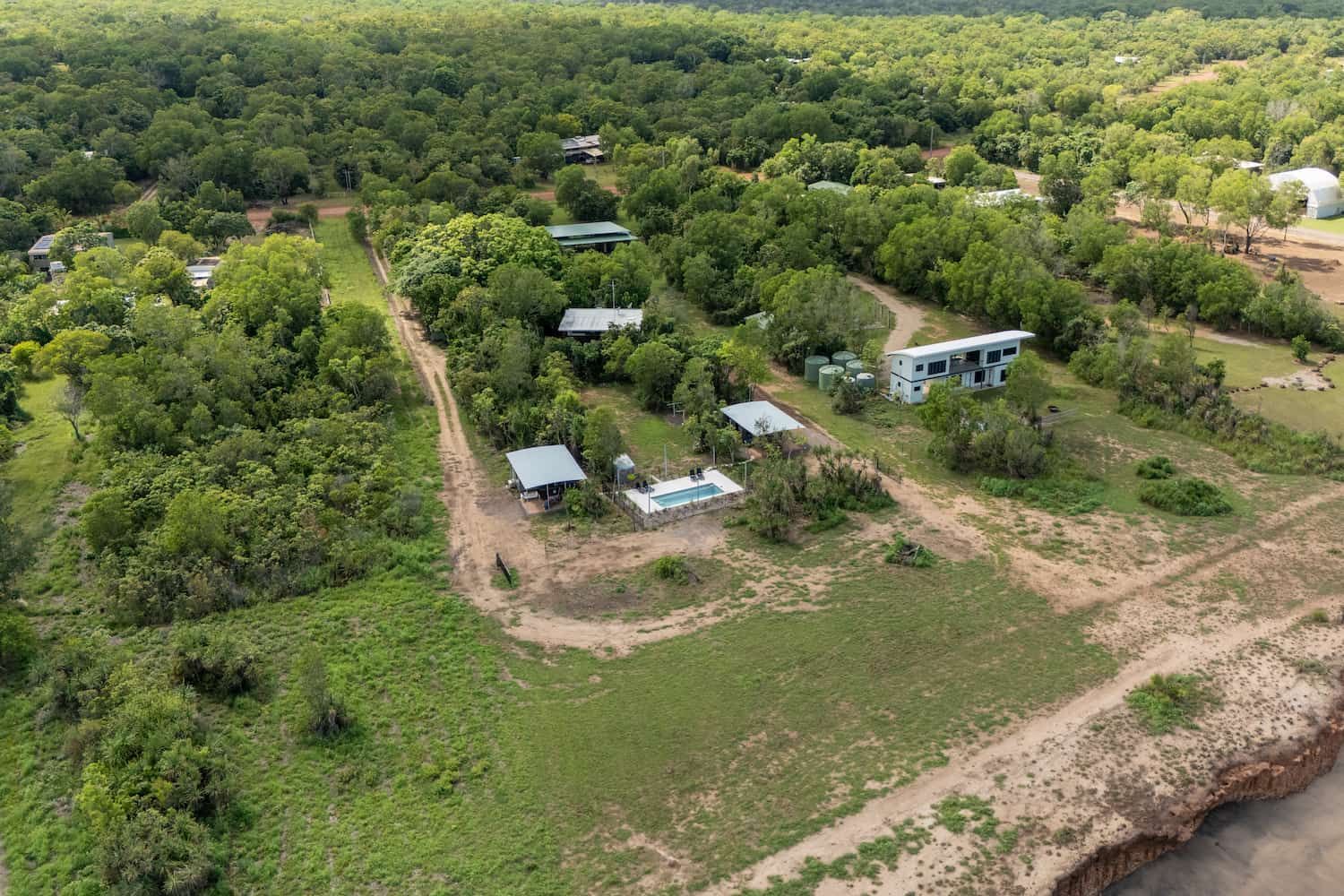 An Aerial View of a House in the Middle of a Forest — Pooltech NT In Alawa, NT