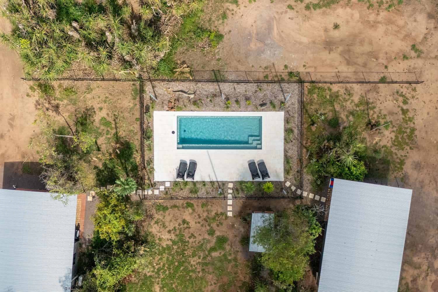 An Aerial View of a Residential Area Next to the Ocean — Pooltech NT In Alawa, NT