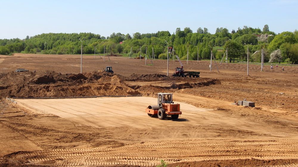 Construction Site With a Soil Compactor Smoothing the Earth — BC Earthmoving & Civil Construction in East Barron QLD
