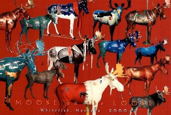 A group of moose painted in different colors on a red background